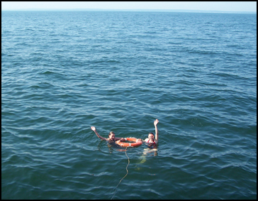 Ms. Robinson and Ms. Laufer wave from the endless waters of Long Island Sound. (Flimflammery by request)