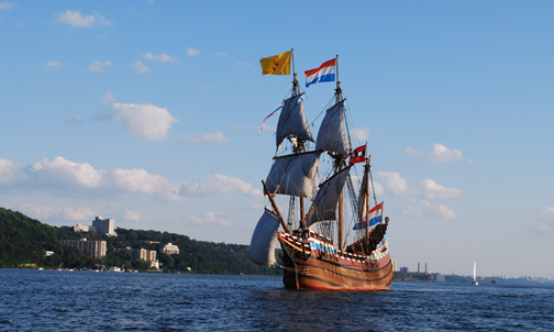The Half Moon under full sail, with Yonkers on the distant horizon.