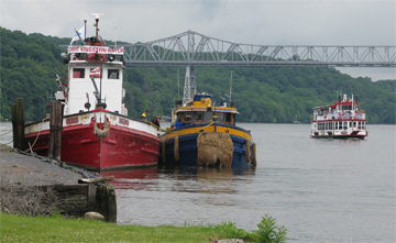 The John J Harvey and Governor Cleveland moored at Catskill as the Spirit of the Hudson motors past.