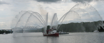 The John J Harvey displays its water cannons.