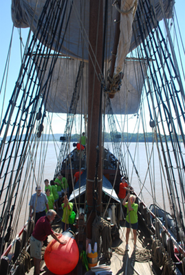Students set the main sail.